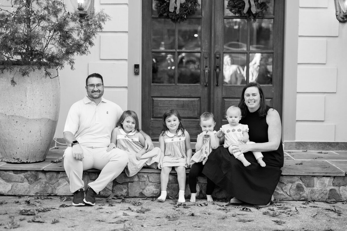 Dr. Meg Cochran with her family — mom of four and postpartum recovery specialist